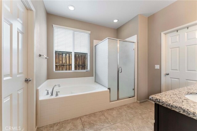 45019 Carla Ct, Lake Elsinore, CA 92532 - full bath with a bath, a stall shower, vanity, and tile patterned flooring