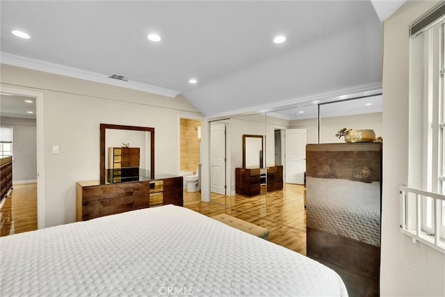 1826 N Berendo St, Los Angeles, CA 90027 - bedroom with wood finished floors, crown molding, recessed lighting, lofted ceiling, and ensuite bathroom