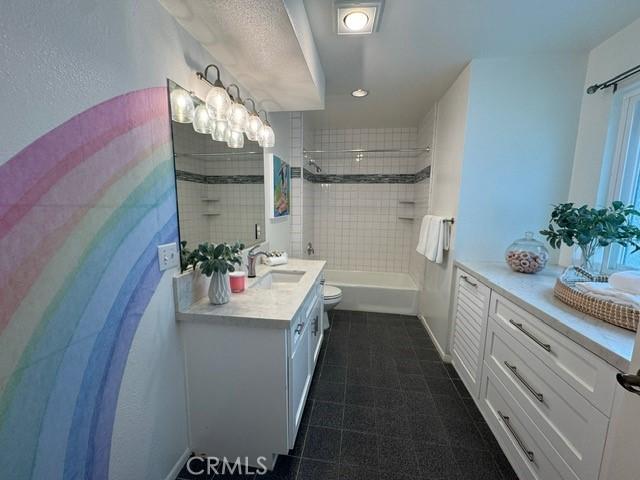 854 Cypress Ave, Hermosa Beach, CA 90254 - bathroom with toilet, vanity, tub / shower combination, and tile patterned floors