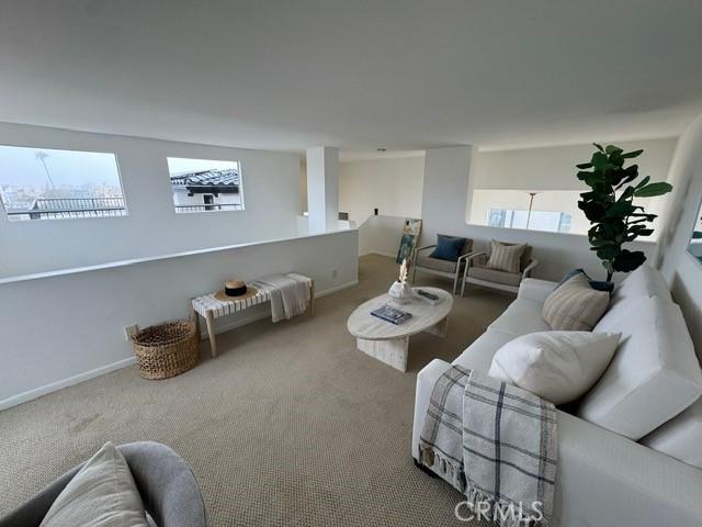 854 Cypress Ave, Hermosa Beach, CA 90254 - carpeted living area featuring baseboards