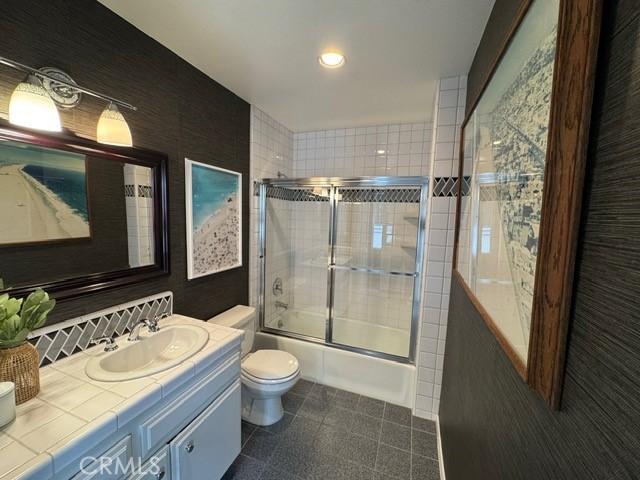854 Cypress Ave, Hermosa Beach, CA 90254 - full bathroom featuring toilet, vanity, combined bath / shower with glass door, and tile patterned flooring