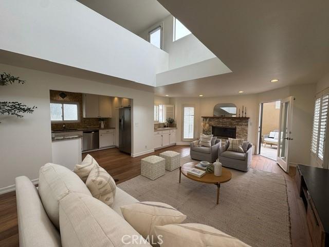 854 Cypress Ave, Hermosa Beach, CA 90254 - living room with wood finished floors, a fireplace, baseboards, and recessed lighting