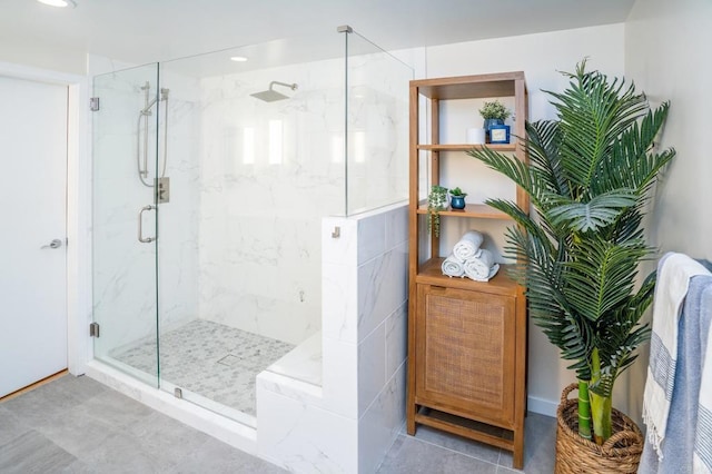 full bathroom featuring a marble finish shower and recessed lighting