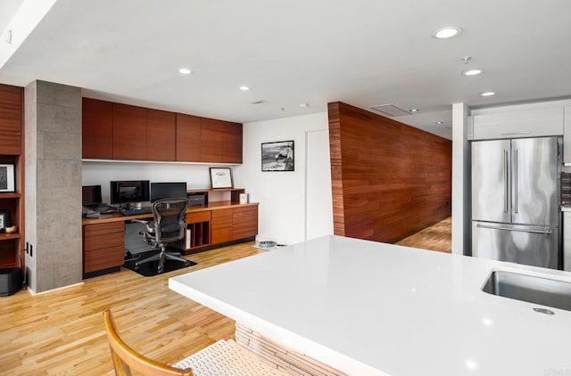 home office with recessed lighting and light wood-style flooring
