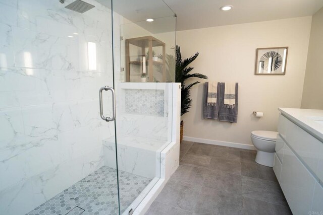 1431 Pacific Hwy Unit 315, San Diego, CA 92101 - full bath featuring vanity, a marble finish shower, toilet, recessed lighting, and baseboards