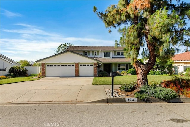 9213 Orange St, Rancho Cucamonga, CA 91701 - traditional-style house with an attached garage, driveway, and brick siding