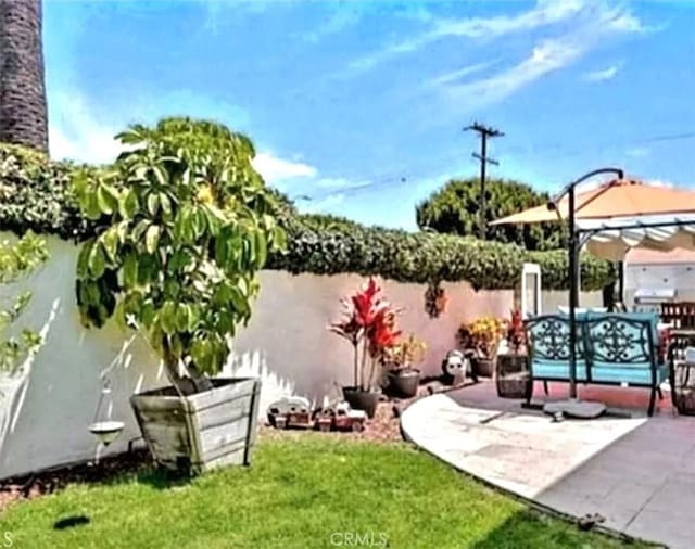 view of yard featuring a patio and a gazebo