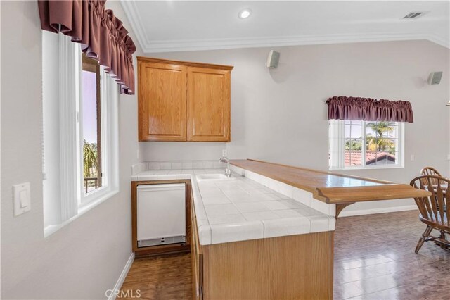 23651 Cruise Circle Dr, Canyon Lake, CA 92587 - kitchen with tile countertops, ornamental molding, a sink, baseboards, and a peninsula