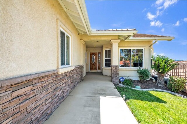 23651 Cruise Circle Dr, Canyon Lake, CA 92587 - view of exterior entry featuring stucco siding