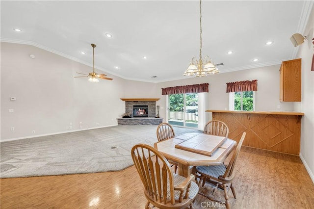 23651 Cruise Circle Dr, Canyon Lake, CA 92587 - dining area with a stone fireplace, light wood-style flooring, ceiling fan, vaulted ceiling, and recessed lighting