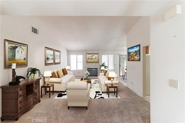 1434 Senator Way, San Jacinto, CA 92583 - living area featuring light carpet, a glass covered fireplace, and vaulted ceiling
