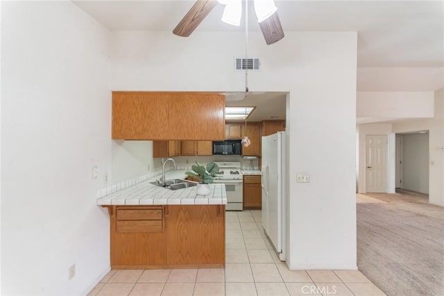 1434 Senator Way, San Jacinto, CA 92583 - kitchen featuring white appliances, a sink, a peninsula, tile countertops, and brown cabinetry