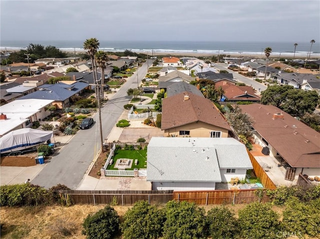 aerial view of residential area with a nearby body of water