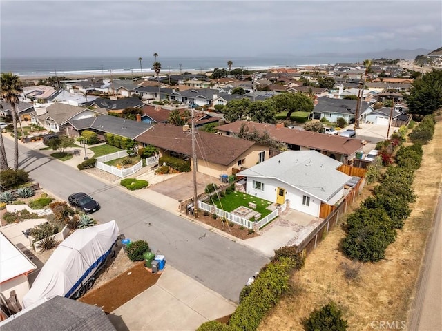 aerial view of residential area with a large body of water