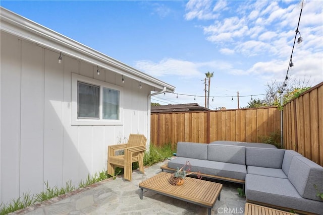 view of patio / terrace featuring an outdoor living space and a fenced backyard