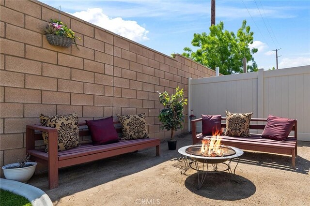 29628 Dotted Mint, Winchester, CA 92596 - view of patio / terrace featuring an outdoor fire pit and fence