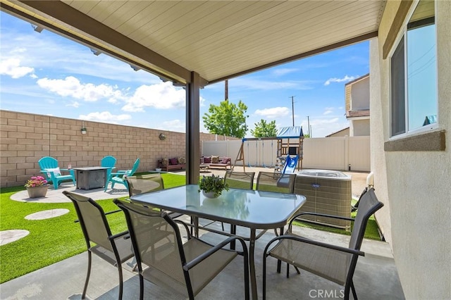 29628 Dotted Mint, Winchester, CA 92596 - view of patio with a fenced backyard, outdoor dining area, an outdoor fire pit, and central air condition unit