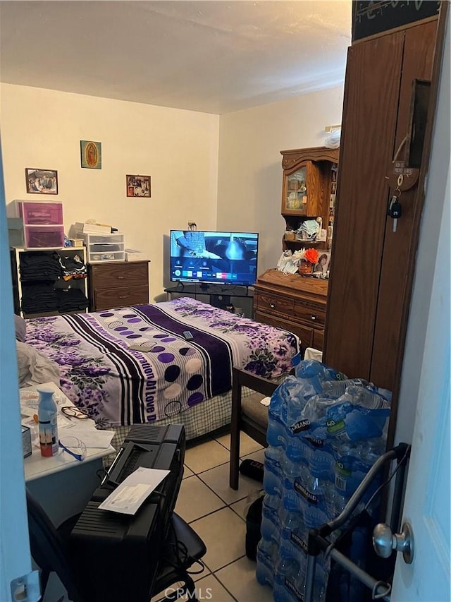 bedroom with light tile patterned floors