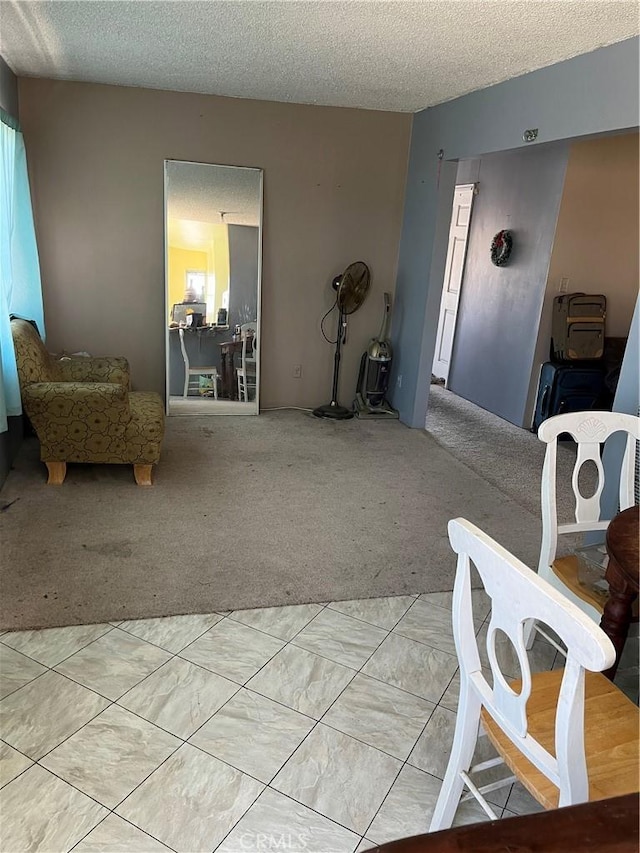 living room with light colored carpet and a textured ceiling