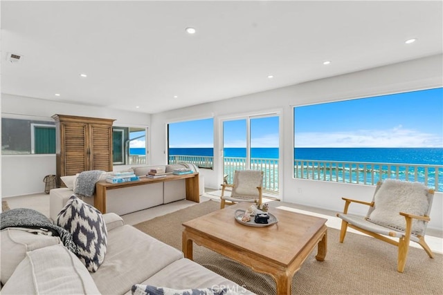 35581 Beach Rd, Dana Point, CA 92624 - living room with light colored carpet, recessed lighting, and a water view