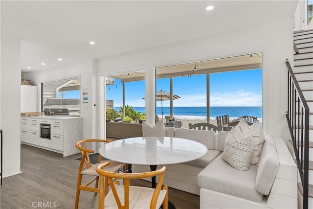 35581 Beach Rd, Dana Point, CA 92624 - dining room featuring stairs, wood finished floors, a water view, and recessed lighting