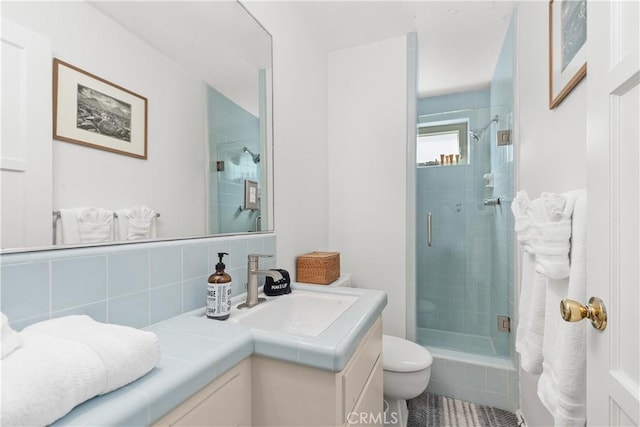 35581 Beach Rd, Dana Point, CA 92624 - full bath with a stall shower, vanity, toilet, and decorative backsplash