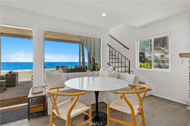 35581 Beach Rd, Dana Point, CA 92624 - dining room featuring wood finished floors, a water view, stairway, recessed lighting, and baseboards