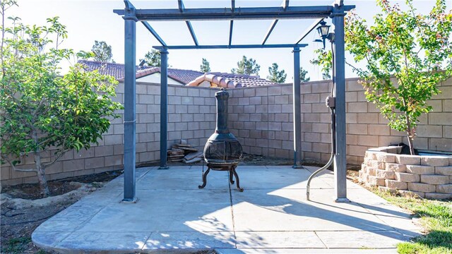 3261 James Ct, Lancaster, CA 93535 - view of patio featuring a fenced backyard and a pergola