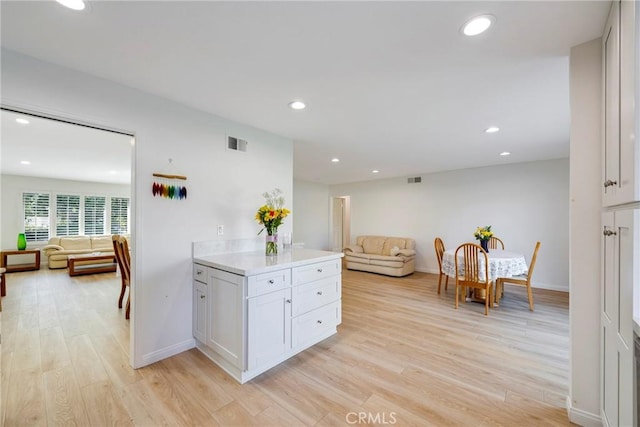 5110 Via Donaldo, Yorba Linda, CA 92886 - kitchen featuring open floor plan, light wood finished floors, light countertops, recessed lighting, and white cabinets