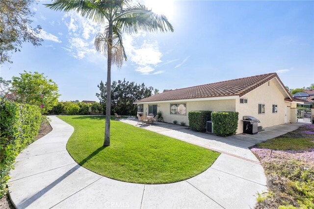 5110 Via Donaldo, Yorba Linda, CA 92886 - view of side of home featuring stucco siding, a patio, and a tile roof