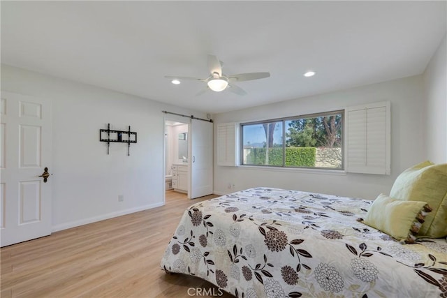 5110 Via Donaldo, Yorba Linda, CA 92886 - bedroom featuring light wood finished floors, a barn door, recessed lighting, a ceiling fan, and connected bathroom