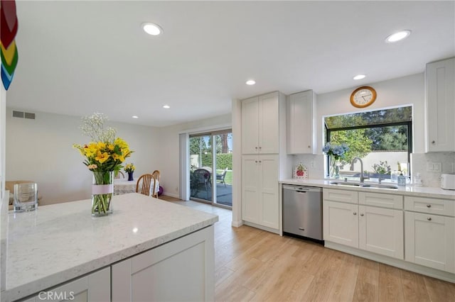 5110 Via Donaldo, Yorba Linda, CA 92886 - kitchen featuring stainless steel dishwasher, a sink, tasteful backsplash, light wood-style floors, and recessed lighting