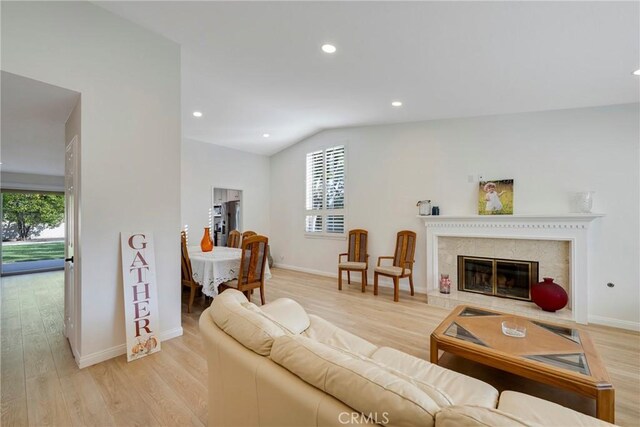 5110 Via Donaldo, Yorba Linda, CA 92886 - living room with healthy amount of natural light, light wood finished floors, lofted ceiling, recessed lighting, and a premium fireplace