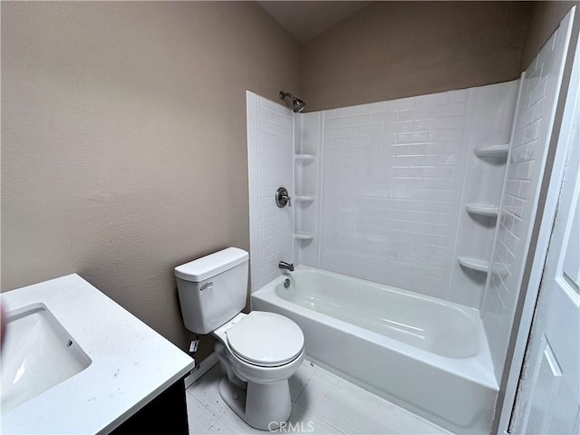 bathroom with vanity, toilet, and washtub / shower combination