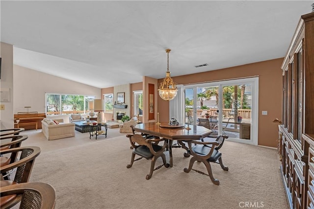 23316 Gray Fox Dr, Canyon Lake, CA 92587 - dining space with light carpet, plenty of natural light, and lofted ceiling