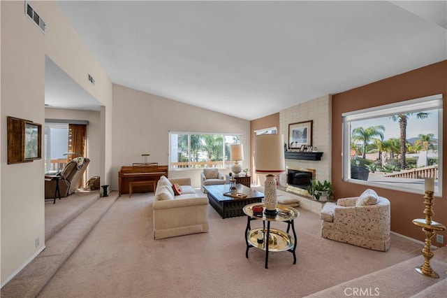 23316 Gray Fox Dr, Canyon Lake, CA 92587 - living area featuring carpet floors, healthy amount of natural light, lofted ceiling, baseboards, and a large fireplace