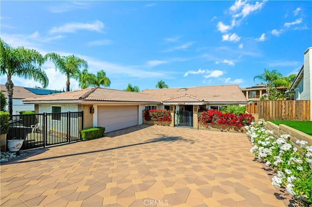 23316 Gray Fox Dr, Canyon Lake, CA 92587 - ranch-style home featuring an attached garage, a gate, a tile roof, driveway, and stucco siding