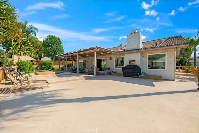 23316 Gray Fox Dr, Canyon Lake, CA 92587 - rear view of property with a chimney, a patio area, a pergola, and fence