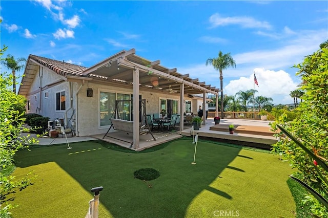 23316 Gray Fox Dr, Canyon Lake, CA 92587 - rear view of property with a putting area, a patio area, stucco siding, a tile roof, and a pergola
