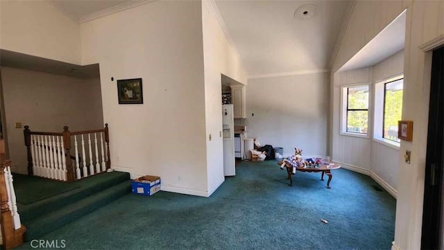 sitting room with carpet, crown molding, baseboards, and lofted ceiling
