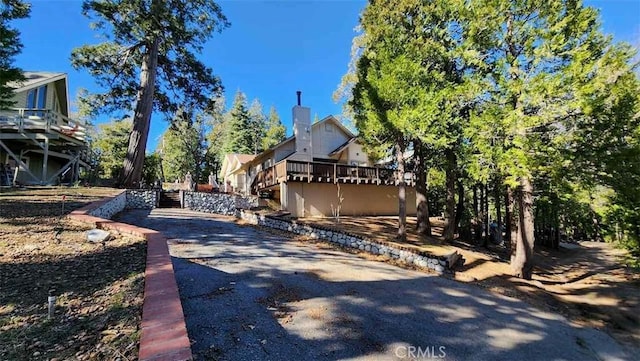 back of property featuring a deck