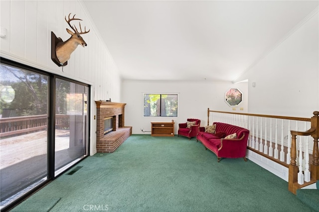 179 Chippewa Ln, Lake Arrowhead, CA 92352 - living room featuring carpet flooring, lofted ceiling, ornamental molding, and a brick fireplace