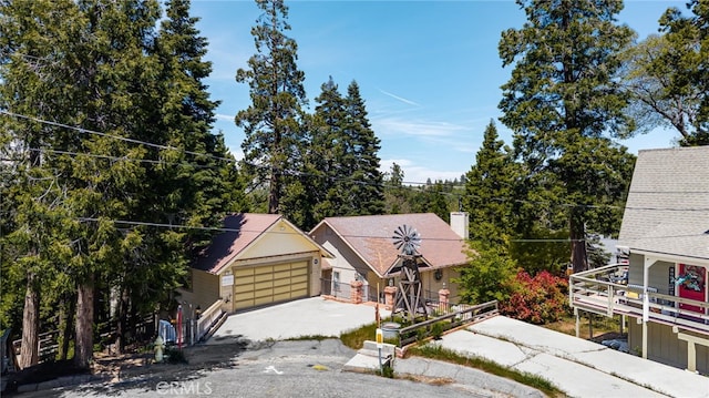 179 Chippewa Ln, Lake Arrowhead, CA 92352 - view of front facade with a detached garage and a chimney