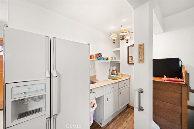 179 Chippewa Ln, Lake Arrowhead, CA 92352 - kitchen with white fridge with ice dispenser, wood finished floors, light countertops, and open shelves