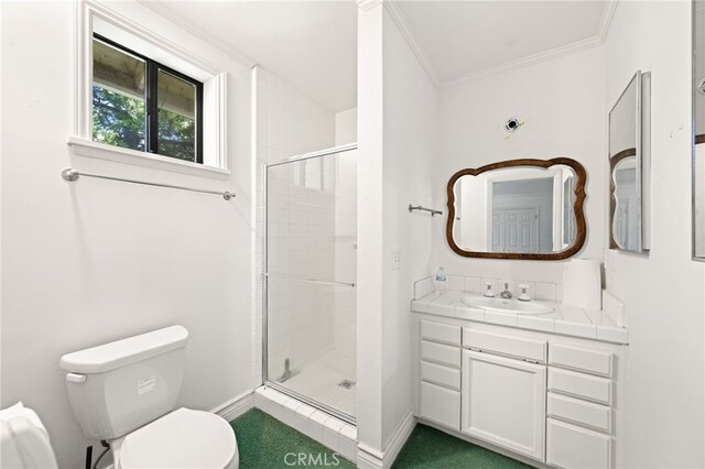 179 Chippewa Ln, Lake Arrowhead, CA 92352 - bathroom with a stall shower, toilet, baseboards, ornamental molding, and vanity
