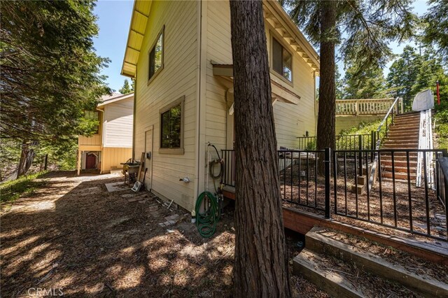 179 Chippewa Ln, Lake Arrowhead, CA 92352 - view of side of property with stairs and a wooden deck