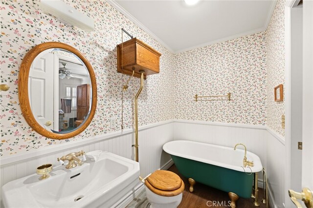179 Chippewa Ln, Lake Arrowhead, CA 92352 - full bathroom with wallpapered walls, a sink, wainscoting, crown molding, and a freestanding tub