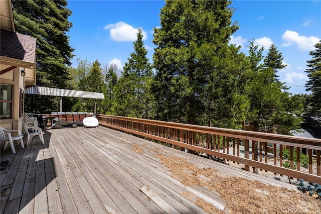 179 Chippewa Ln, Lake Arrowhead, CA 92352 - wooden terrace featuring view of wooded area