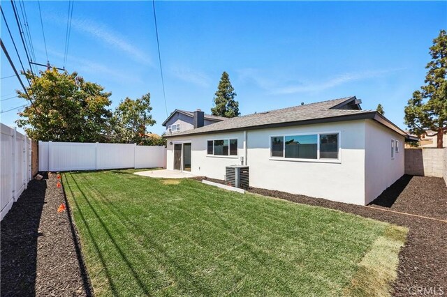 1608 E Helmick St, Carson, CA 90746 - rear view of house with stucco siding, cooling unit, a patio, and roof with shingles