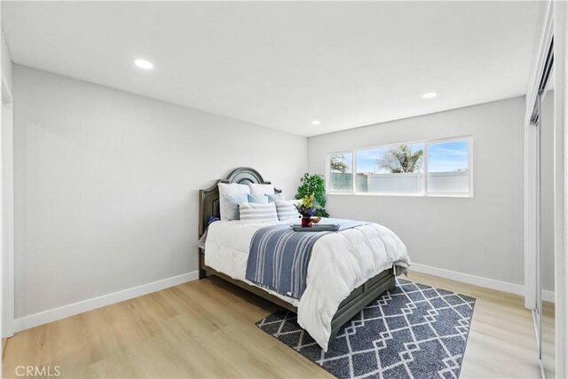 1608 E Helmick St, Carson, CA 90746 - bedroom with light wood-style flooring, baseboards, and recessed lighting